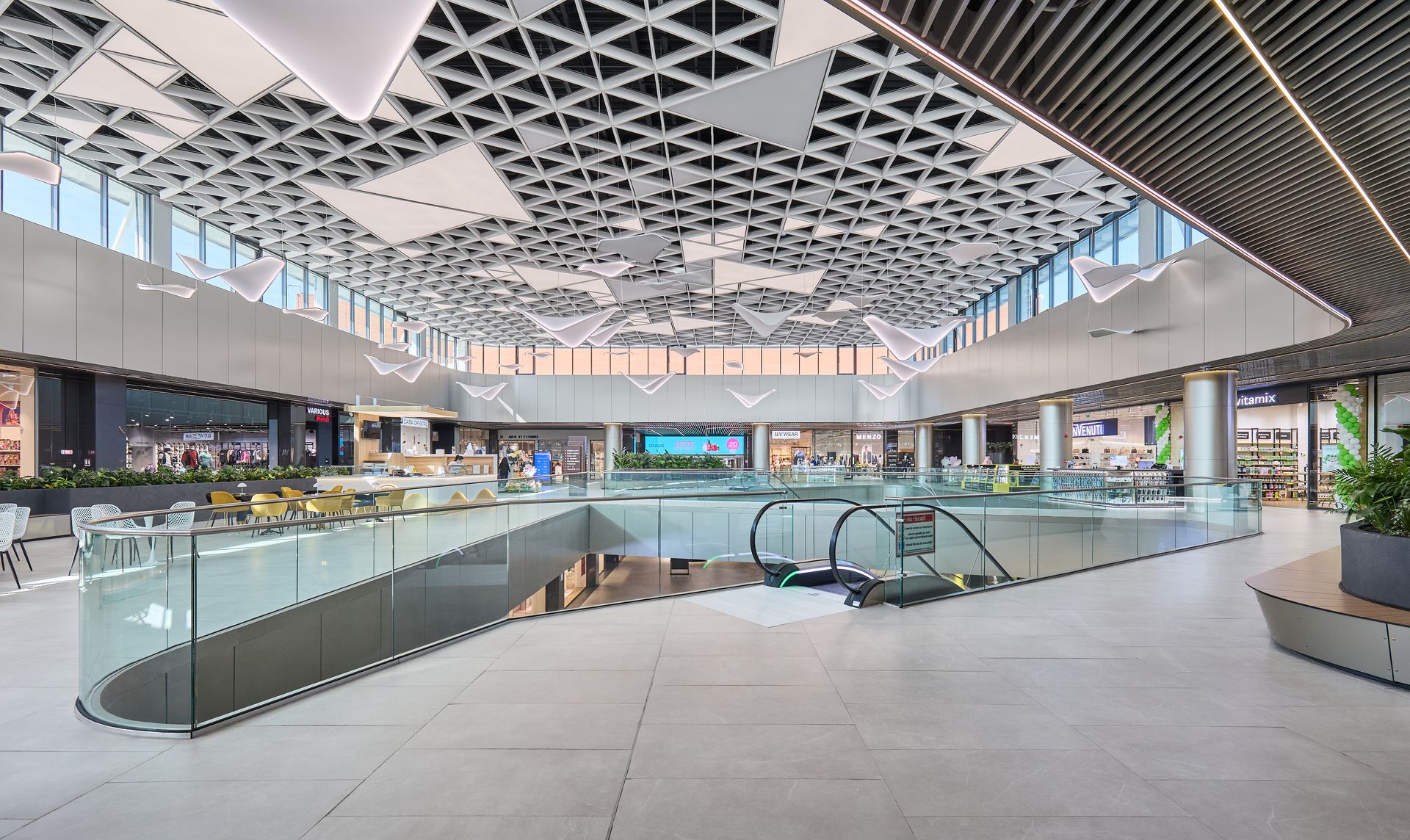 Large interior atrium with a triangular decorative ceiling, Arena Mall Bacău