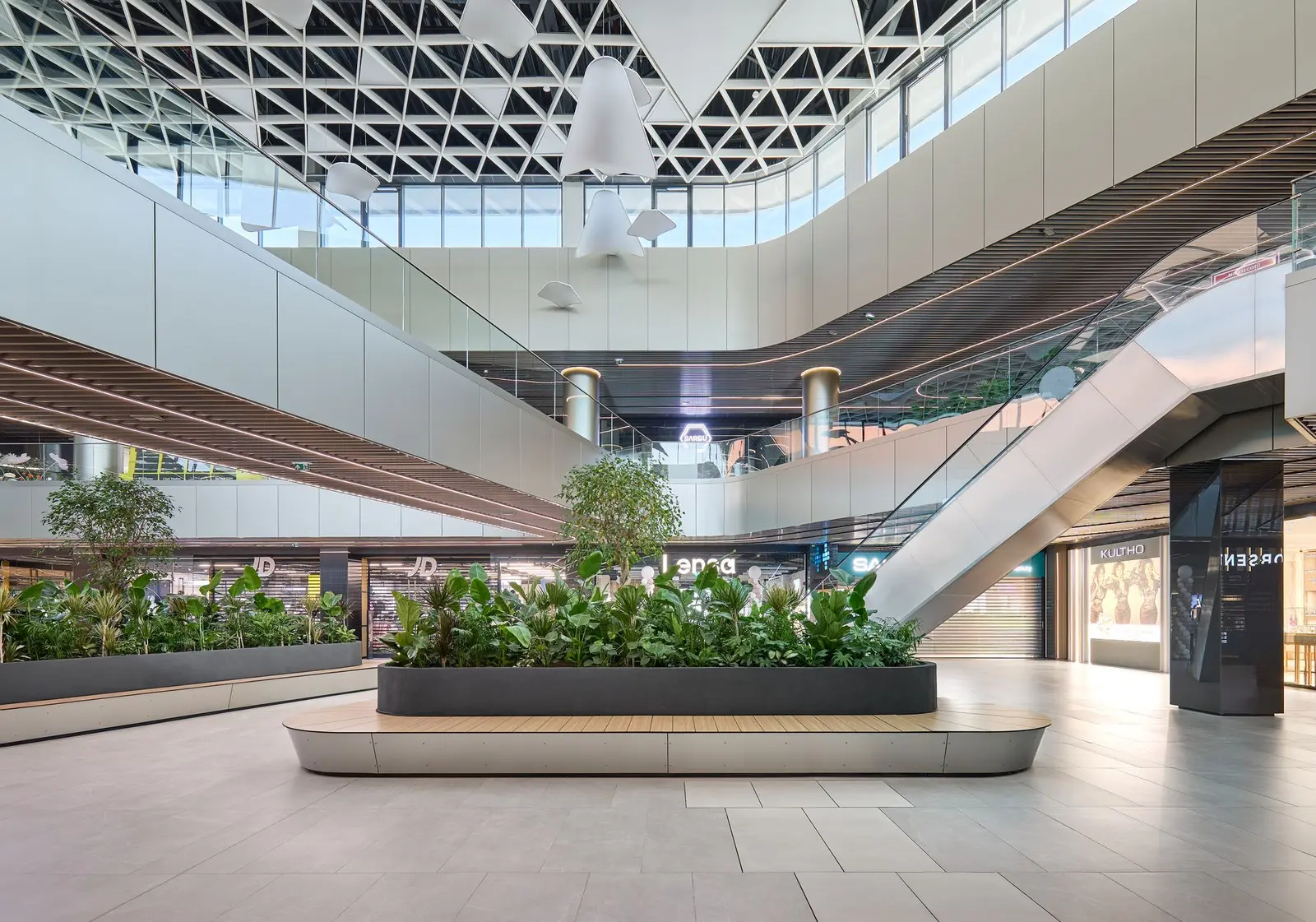 Bright interior atrium with white sculptural ceiling and greenery, Arena Mall Bacău