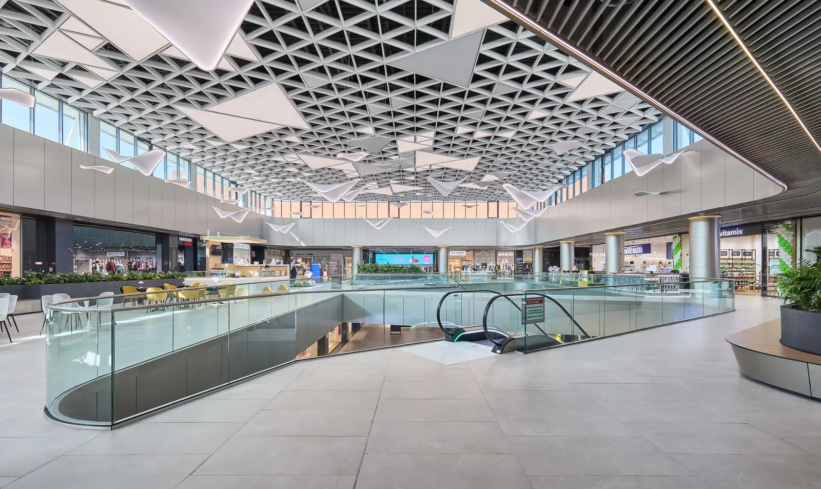 Large interior atrium with a triangular decorative ceiling, Arena Mall Bacău