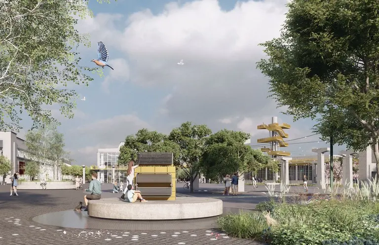 Central square with a recovered industrial monument, a rain garden and the observation tower in the background.