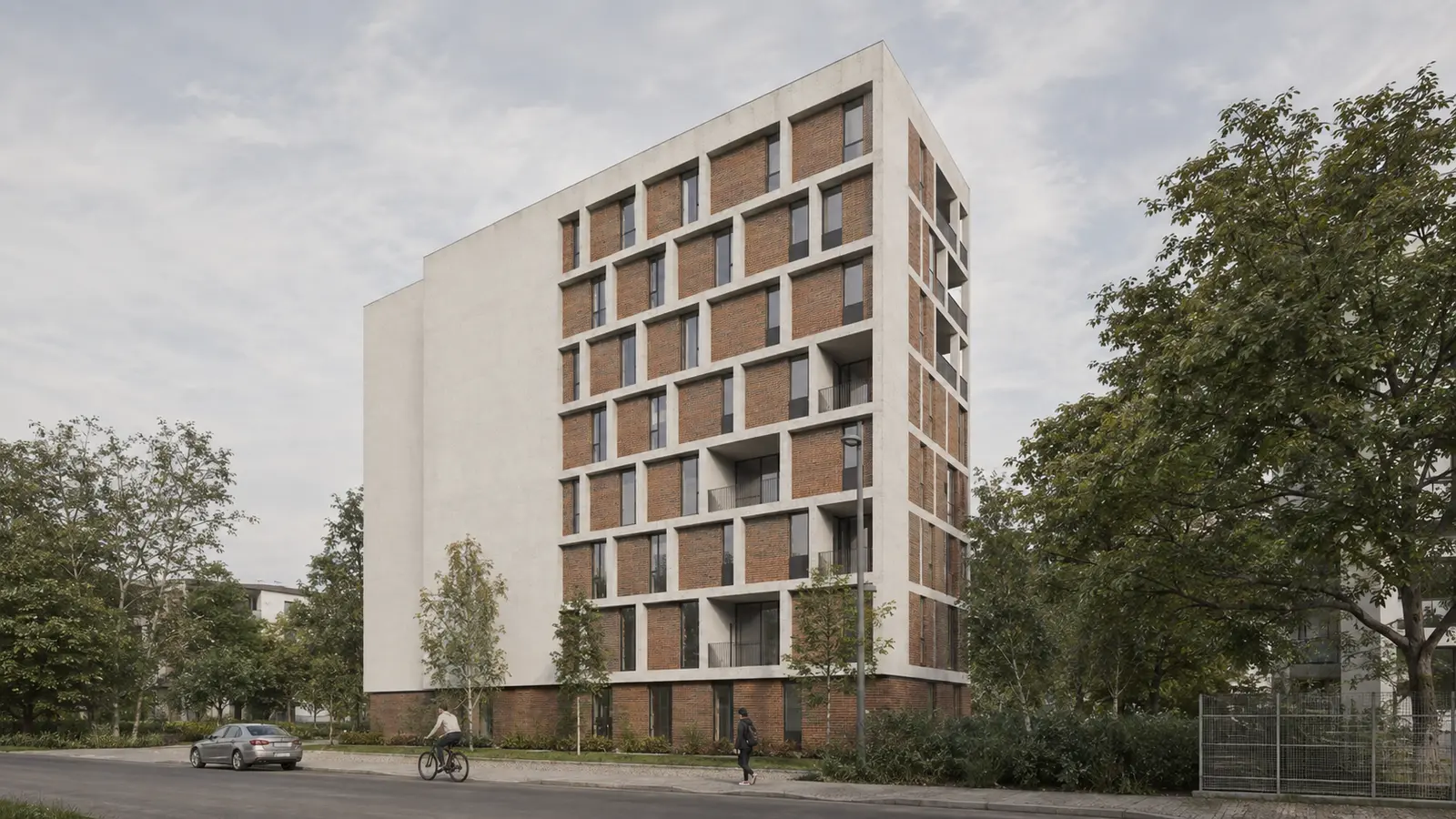 The long street facade: the field of exposed brick held within the white grid, next to the smooth white party wall of the volume