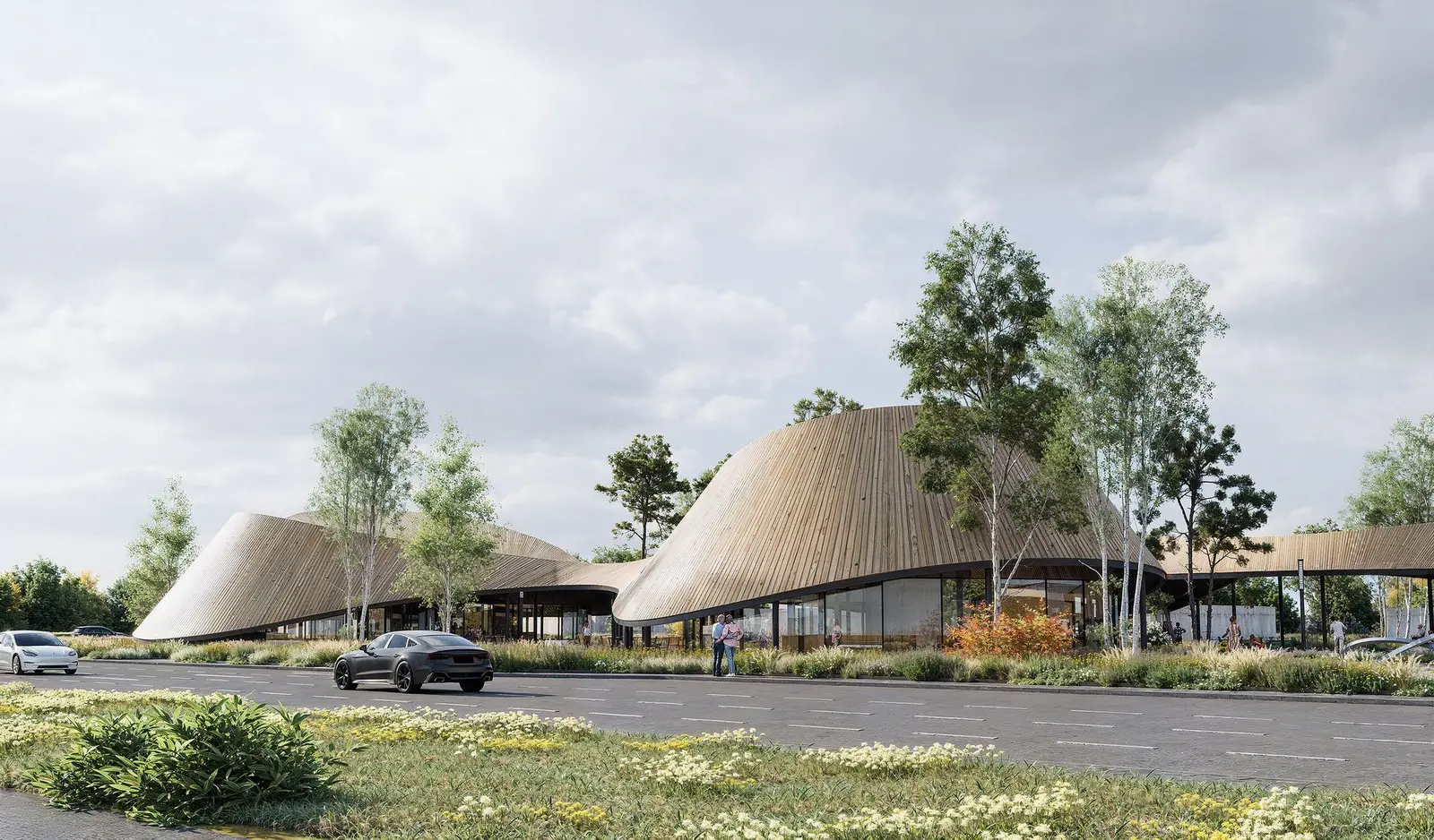 The long roadside pavilion facade, with the timber canopy sweeping down to the ground and a fully glazed ground floor