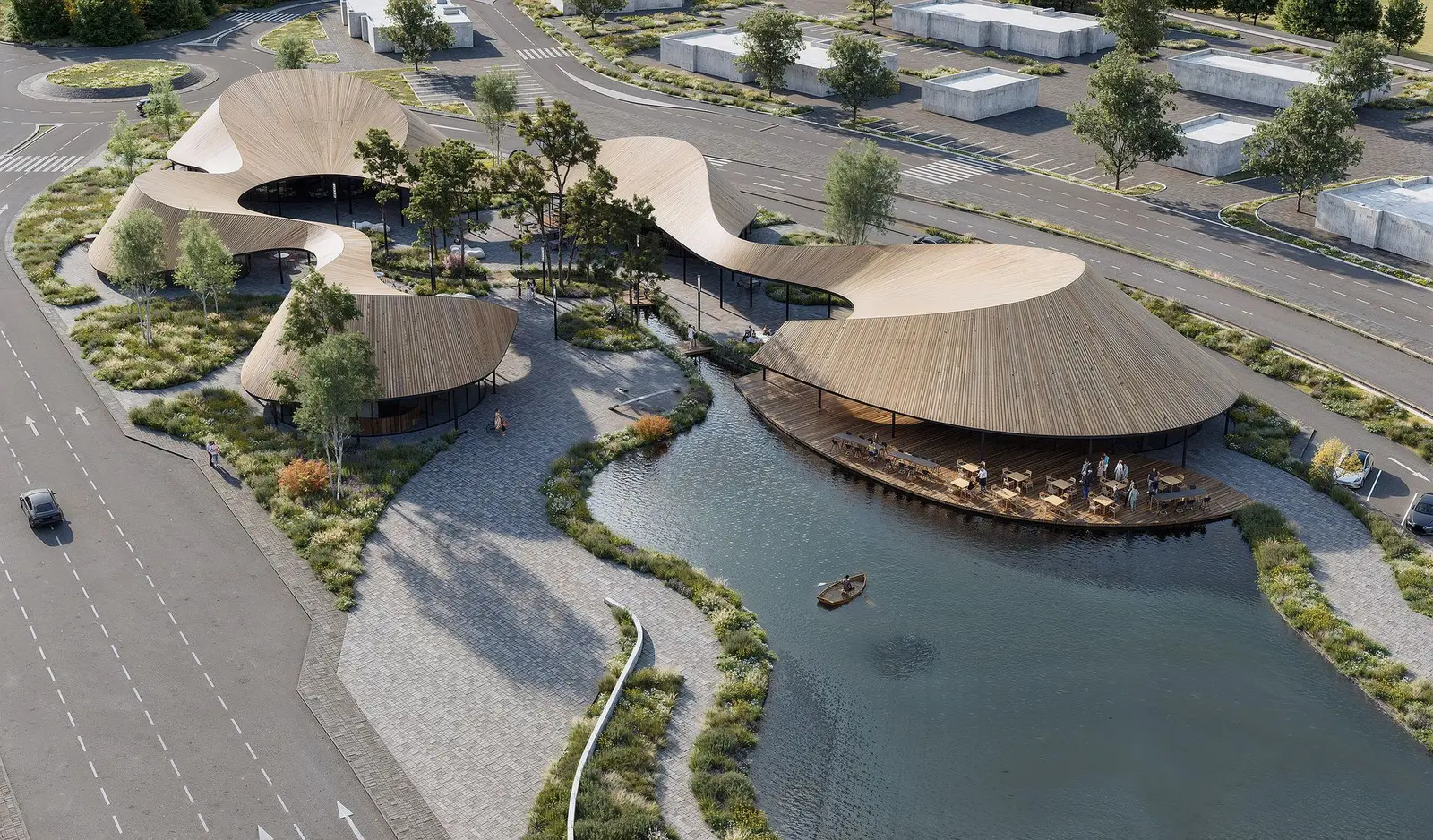 Oblique aerial view, with the timber-slatted roofs, the open water and the parking held at the edge